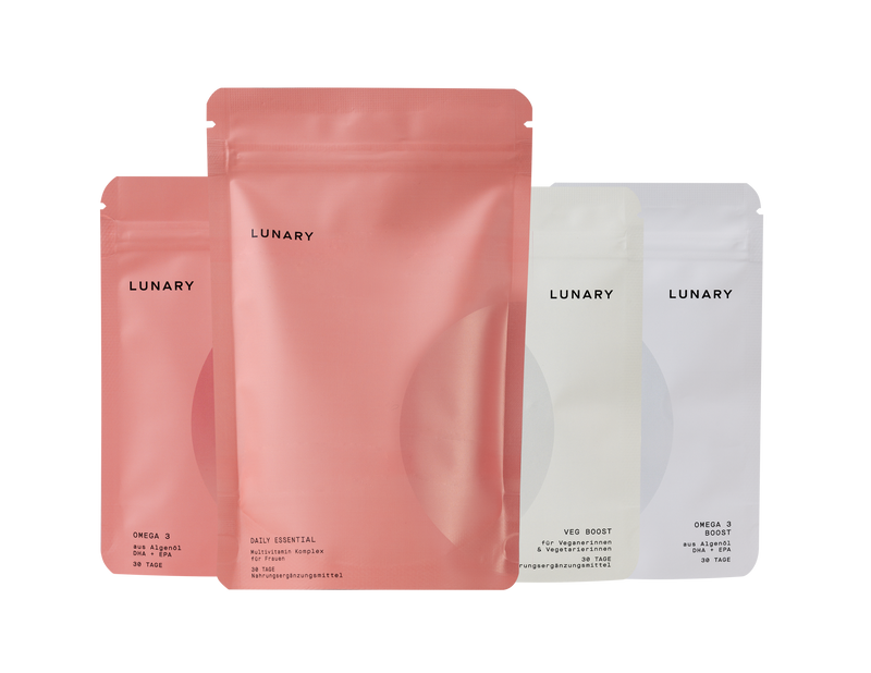 Set Daily Essential plus Veg Boost products in stylish packaging for vegan nutrition.